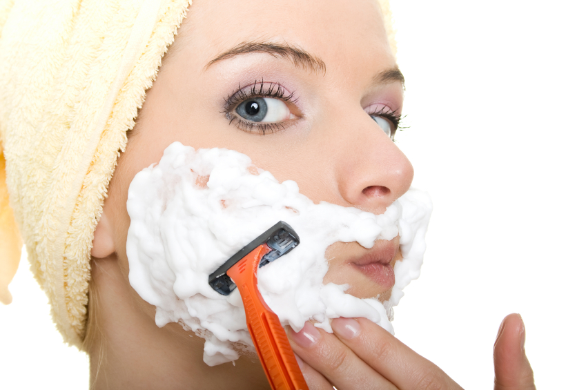 woman shaving isolated on white.
